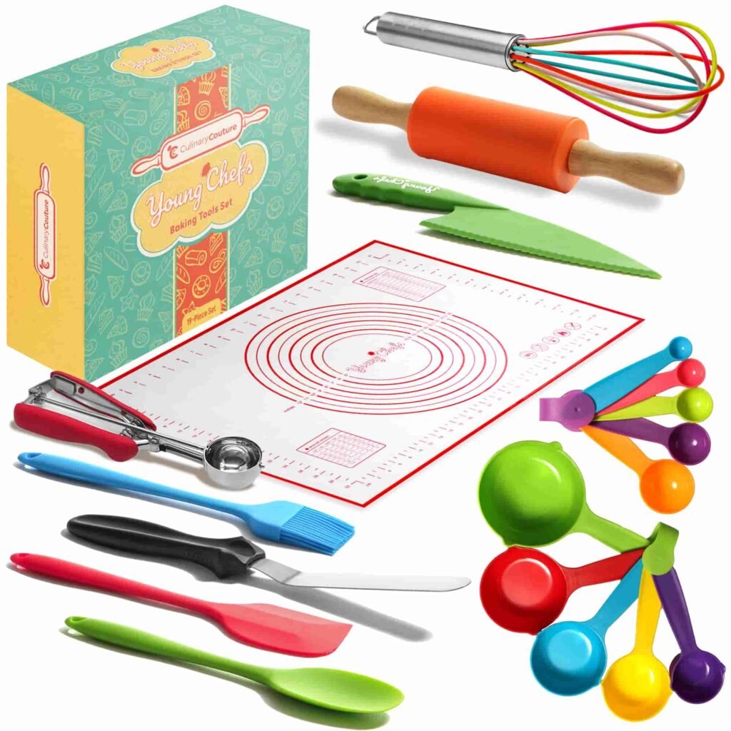 A collection of colorful baking tools including a rolling pin, whisk, measuring cups, spatulas, a baking mat, a knife, and a box labeled "Young Chefs Baking Tools Set."
